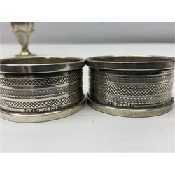 Early 20th century silver pepper and a pair of 1930s silver napkin rings, all hallmarked 