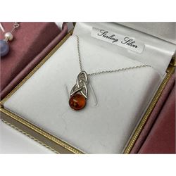 Silver jewellery comprising Baltic amber dolphin pendant necklace, Baltic amber Celtic design pendant necklace and five pairs of stone set pendant earrings, all boxed 