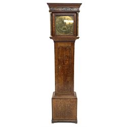 Early 19th century oak longcase clock, projecting cornice over frieze painted with scrolls, square glazed door enclosed by plain pilasters, square brass dial with ornate cast metal spandrels, Roman chapter ring and false subsidiary date aperture, engraved decoration and inscribed 'Torkington, Newcastle', 30-hour movement striking on bell