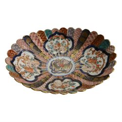 Japanese Imari dish, with scalloped edge, the internal decoration with panels of blossoming branches and a central bird, together with another imari bowl and three vases, scalloped dish H7cm