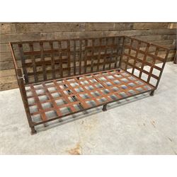 Wrought iron strapwork garden day bed, lattice back and sides