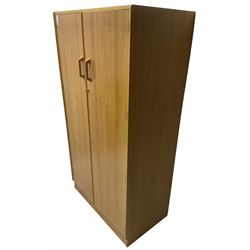 E. Gomme for G-Plan - 'Brandon' light oak double wardrobe, the interior fitted with hanging rail and shelves 