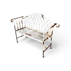 Small wrought metal two seat garden bench, finished in distressed white paint