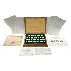 The Stamps of Royalty collection consisting of twenty-five sterling silver hallmarked stamp replicas, housed in a fitted wooden display case, with certificates, polishing cloth and certificates