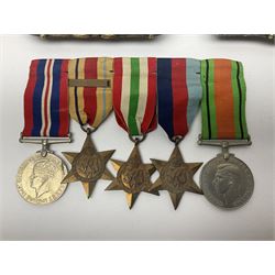 WW2 group of five medals comprising 1939-45 War Medal, Defence Medal, 1939-45 Star, Italy Star and Africa Star with 1st Army clasp; all with ribbons on wearing bar; pair of French brass dishes cast with titled military scenes; hallmarked silver ARP badge; pair of cloth 'Report and Control' shoulder titles etc