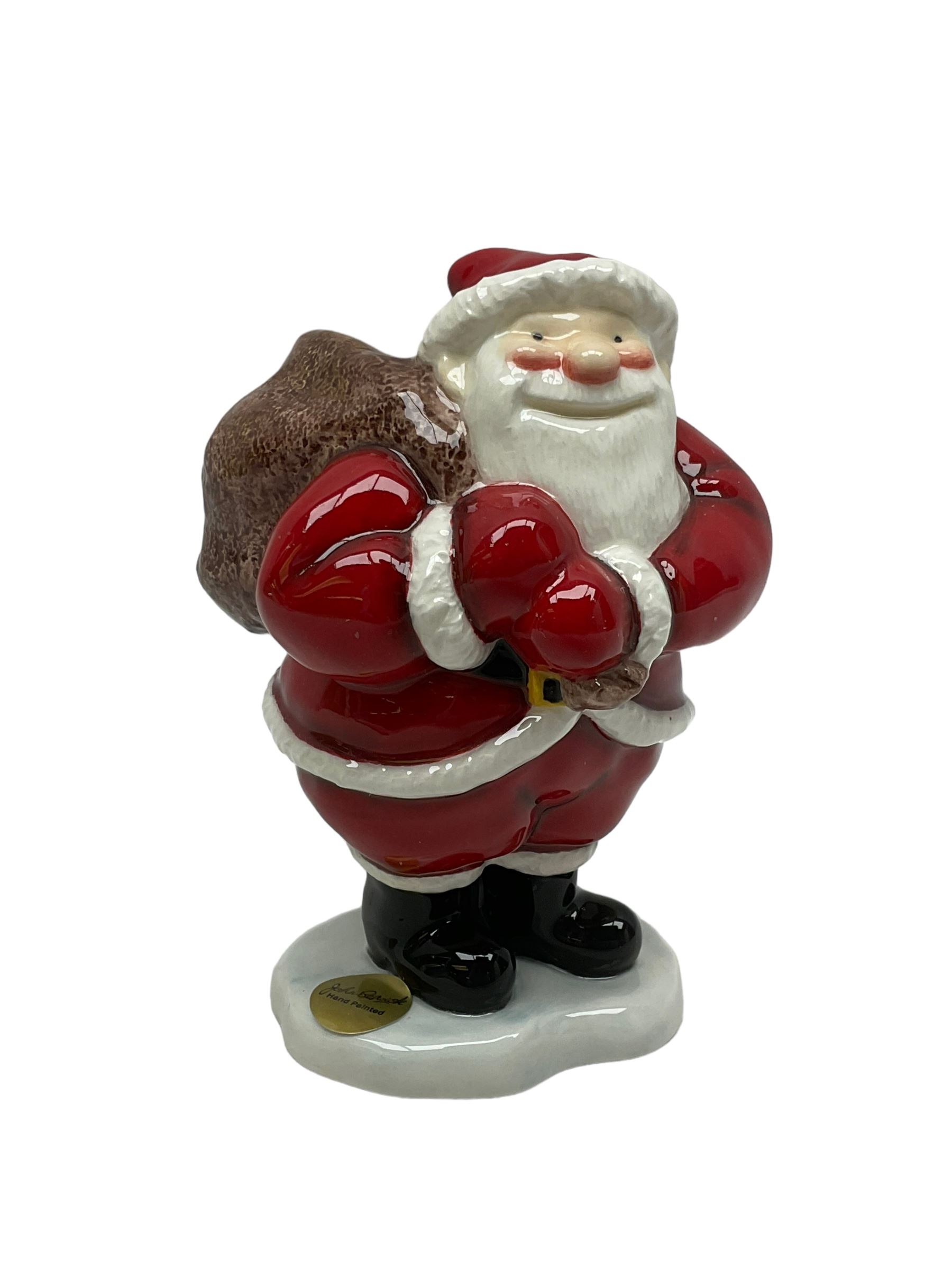 Two Beswick figures, composing The Snowman and Father Christmas, together with Border Fine Arts Enamel dish depicting a scene from The Snowman A3995, all in original boxes 