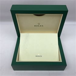 Rolex green leather box, with decorative pleated panel to cover, opening to reveal cream velvet interior, the inside lid stamped Rolex with gilded crown logo, printed mark beneath 'Rolex SA Geneve Swiss 39139.64, together with Rolex note paper in box, box H7.7cm