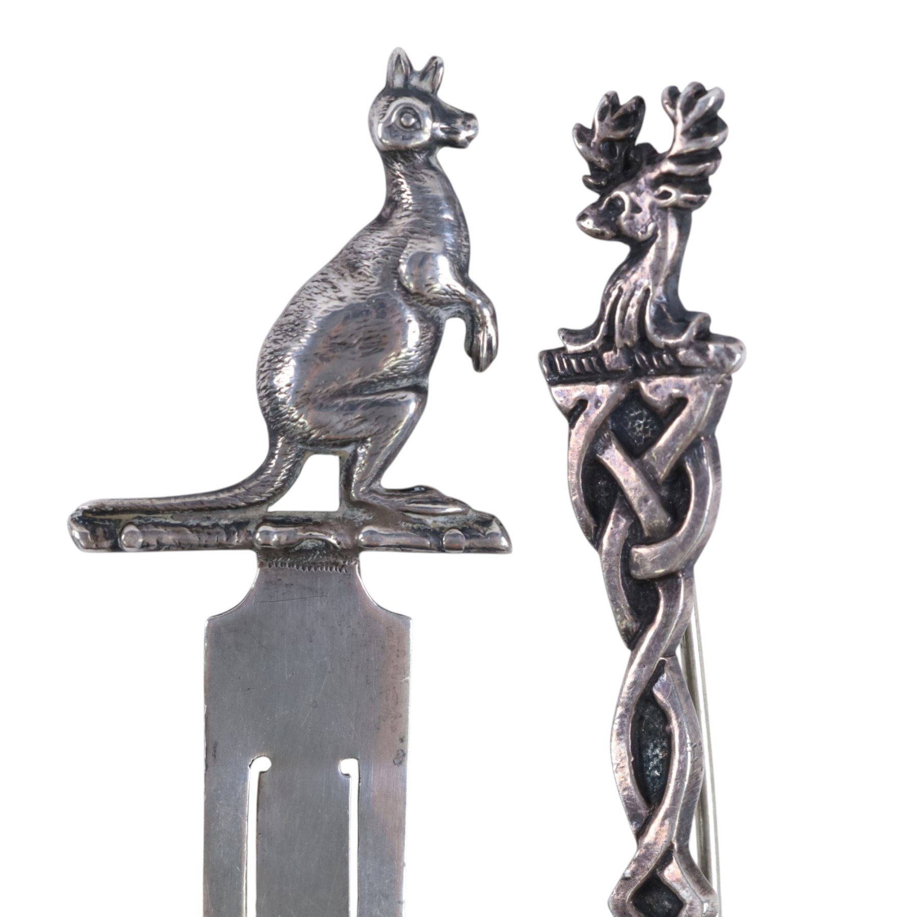 Collection of silver, including Kangaroo book mark, six silver brooches, comprising silver-gilt scottie dog, fairy, marcasite cat, Celtic stag, Essex regiment and wren, vesta case and bible locket