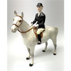 A Beswick equestrian figure modelled as a huntswoman on grey horse, with printed mark beneath 