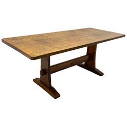 Yorkshire Oak 'Kingpost' - oak dining table, rectangular adzed top on tapered end supports, united by pegged stretchers carved with kingpost signature, on sledge feet, by Robert Ingham, Burton Leonard, Harrogate 