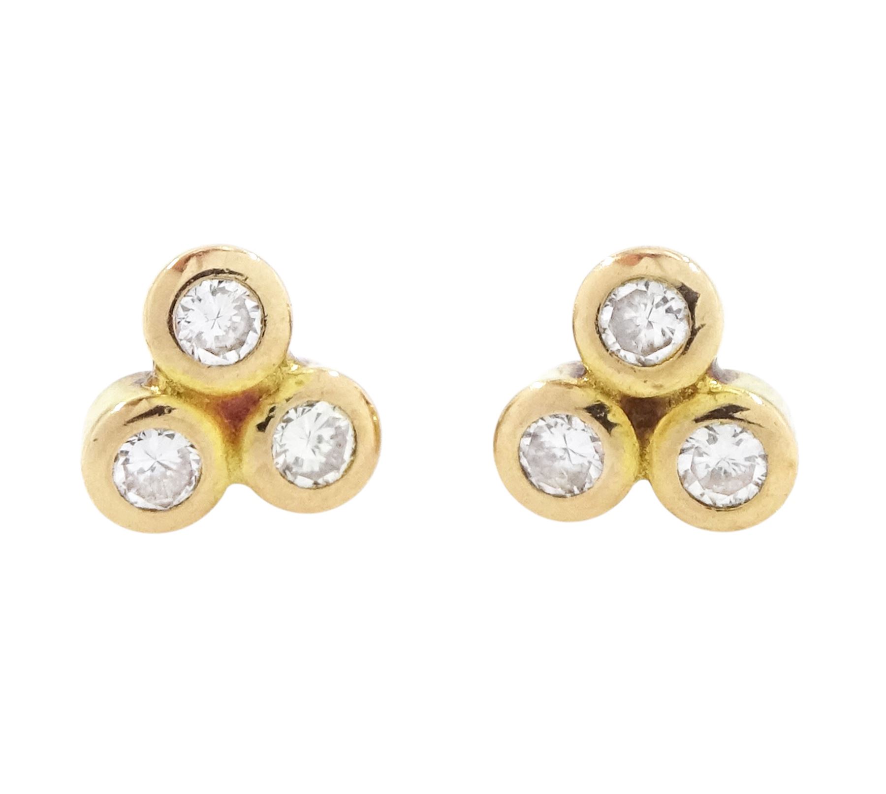 Pair of 9ct gold trefoil diamond stud earrings, each bezel set with three round brilliant cut diamonds