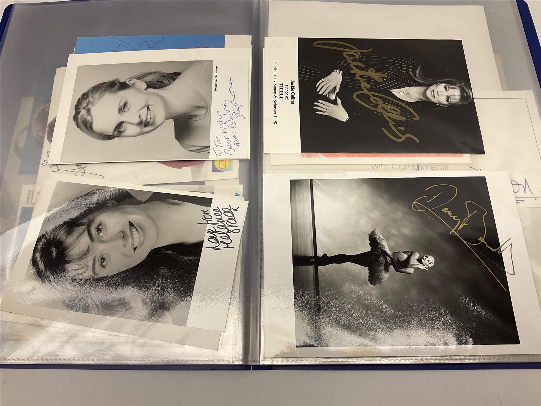 Two folders of over fifty photographs, cards, compliment slips etc of actors, actresses, celebrities, politicians, sports personalities etc, all bearing signatures, including David Frost, Lloyd Grosman, John Suchet, Julia Somerville and othe GMTV presenters, Carol Vorderman, Jackie Collins, Rolf Harris, Timothy Dalton, Pete Postlethwaite, Magnus magnusson, John Major, Kate Moss, Uri Geller, David Beckham, Peter Alliss, Sharon Davies, Kevin Keegan etc