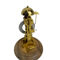 German - Kieninger 20th century 8-day timepiece skeleton clock striking the bell once on the hour, with a silvered chapter ring, Roman numerals and pierced steel hands, mounted on a turned wooden base with a glass dome. With key and pendulum.
