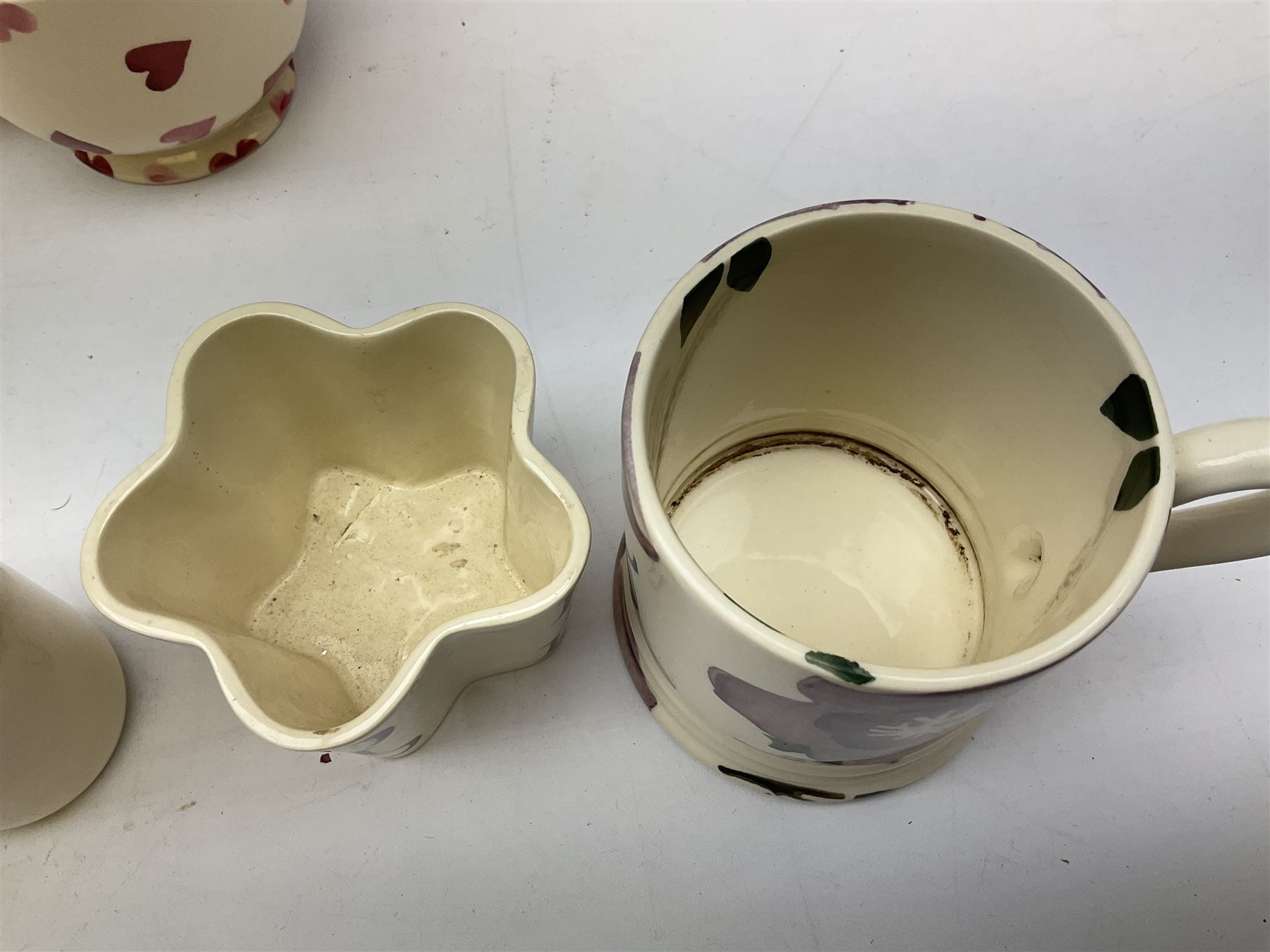 Collection of Emma Bridgewater spongeware ceramics, to include Pink Hearts pattern teapot, milk bottle vase, teacup and saucers, Love & Kisses sugar shaker and large 'I love you more than Marlon Brando' mug, British Birds and Black and White pattern mugs, etc, all with printed marks beneath, tallest H21.5cm
