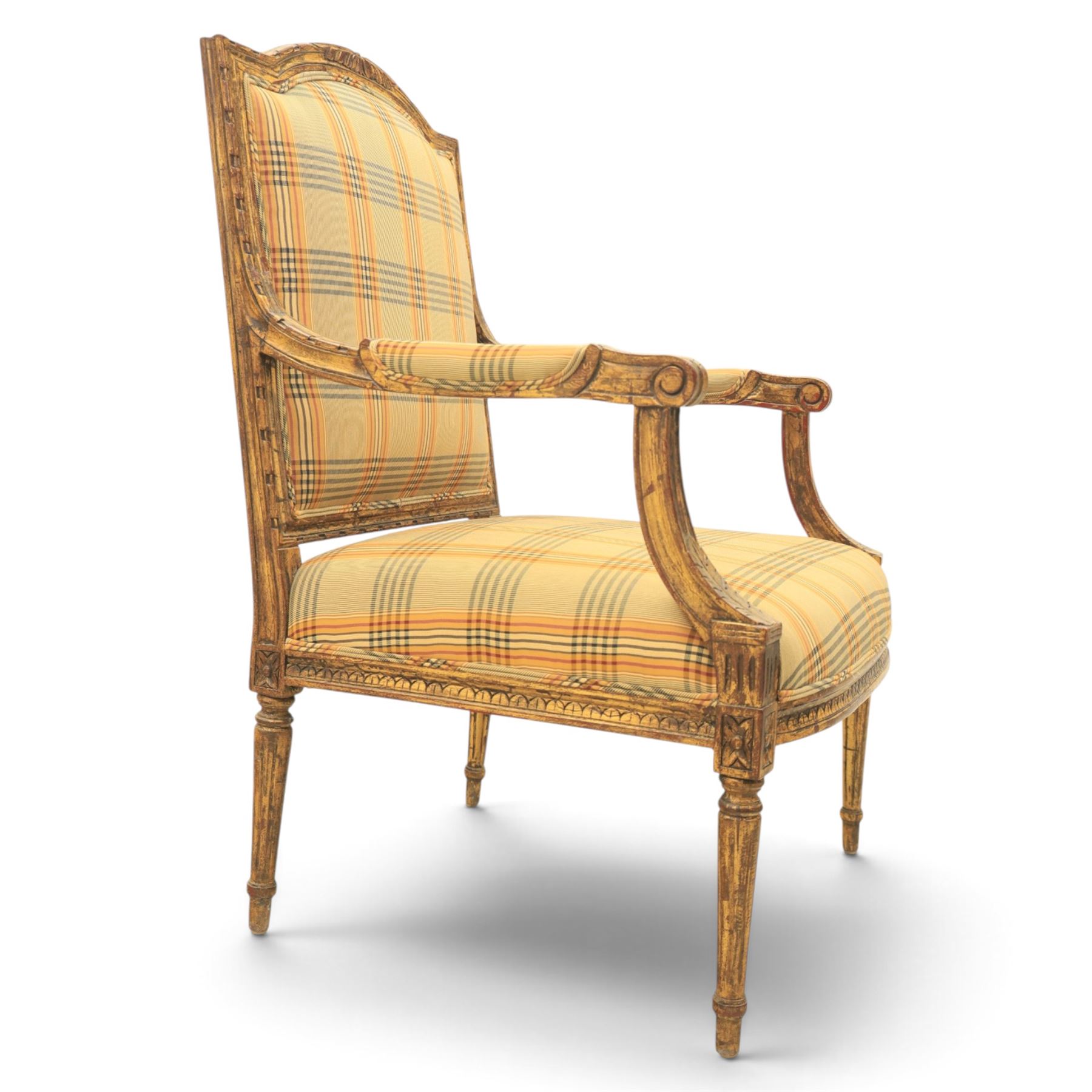 Louis XVI style painted fauteuil, the shaped padded back and overstuffed seat upholstered in cream tartan fabric, with scrolling open arms on fluted supports, the moulded frame with carved ribbon twist, rosette and husk decoration, raised on turned and fluted tapering legs