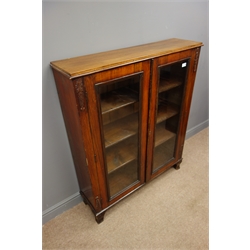  Early 20th century mahogany bookcase, acanthus carved sides, two glazed doors, four shelves, shaped bracket supports, W100cm, H121cm, D28cm  