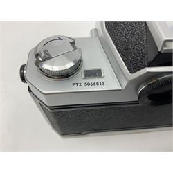 Nikkormat FT2 camera body, serial no. 5066813, in original packaging, together with Nikkormat EL camera body, serial no. 5577358, with Nikon Nikkor 50mm 1:1.8' lens no. 2143575, Nikkormat FT, serial no. 3968385, and Nikomat FT camera body, serial no. 4015491