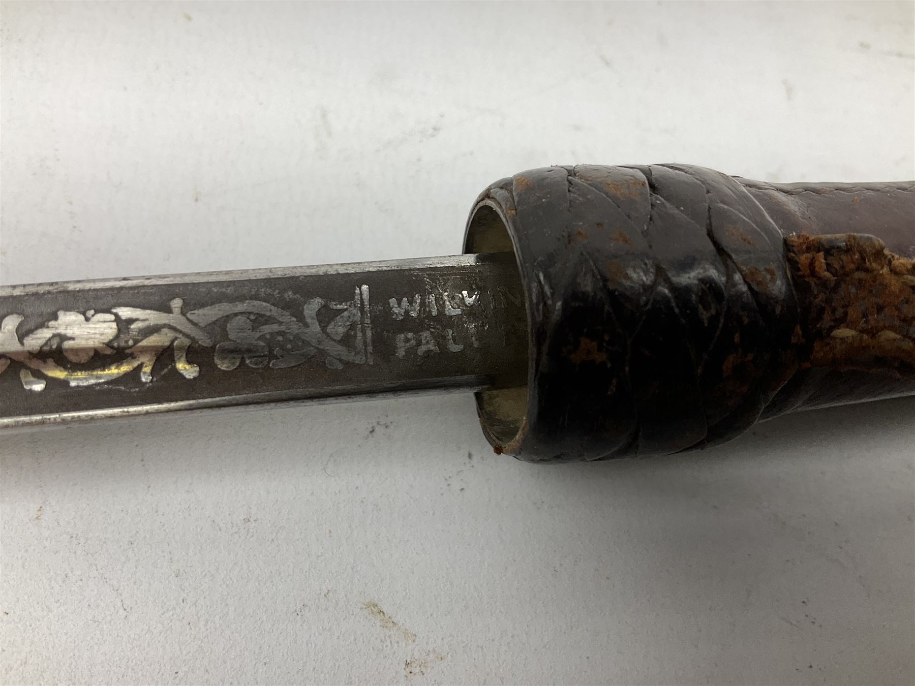 Early 20th century officer's swagger type leather covered sword stick, the 33cm etched single fullered blade marked Wilkinson Pall Mall, with carrying strap L60.5cm