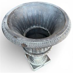 Pair of cast iron Urns on square bases