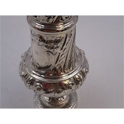 Victorian silver sugar caster, of bellied form, with repousse scroll and foliate decoration, the removable pierced cover with flambeau finial, upon a conforming circular spreading foot, hallmarked Goldsmiths & Silversmiths Co, London 1893, H18.5cm