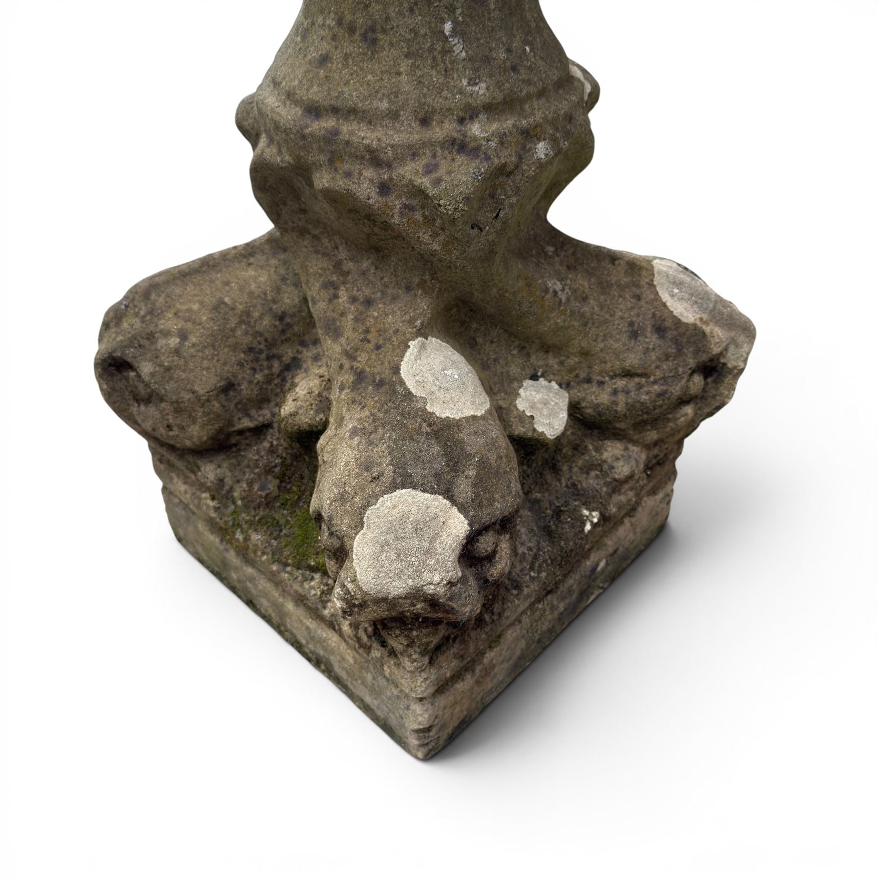 19th century weathered sandstone birdbath, the octagonal canted dished top raised on a ring turned flared pedestal, with four carved stylised dolphins to the squared base