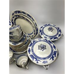 Booths and Cauldon matched tea and dinner wares decorated with blue dragons upon a plain ground heightened with gilt