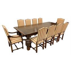Royal Oak Furniture Co - Jacobean style oak dining table, rectangular top with a lunette carved frieze, acanthus carved baluster cup and cover supports joined by angular stretchers (276cm x 122cm, H81cm), and set ten (8+2) oak framed high back dining chairs upholstered in striped fabric with studded detail, turned supports and stretchers