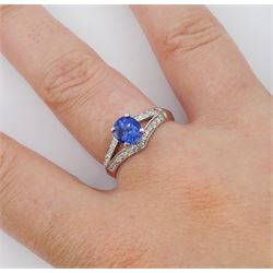 White gold sapphire and diamond ring, single oval cut sapphire of approx 1.00 carat, with split design diamond set shoulders, hallmarked 14ct