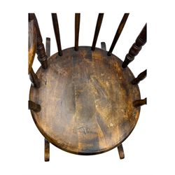 Late 19th century elm and beech Windsor rocking chair, with shaped top rail over turned spindles and curved arms, circular seat raised on turned legs united by stretcher on rockers