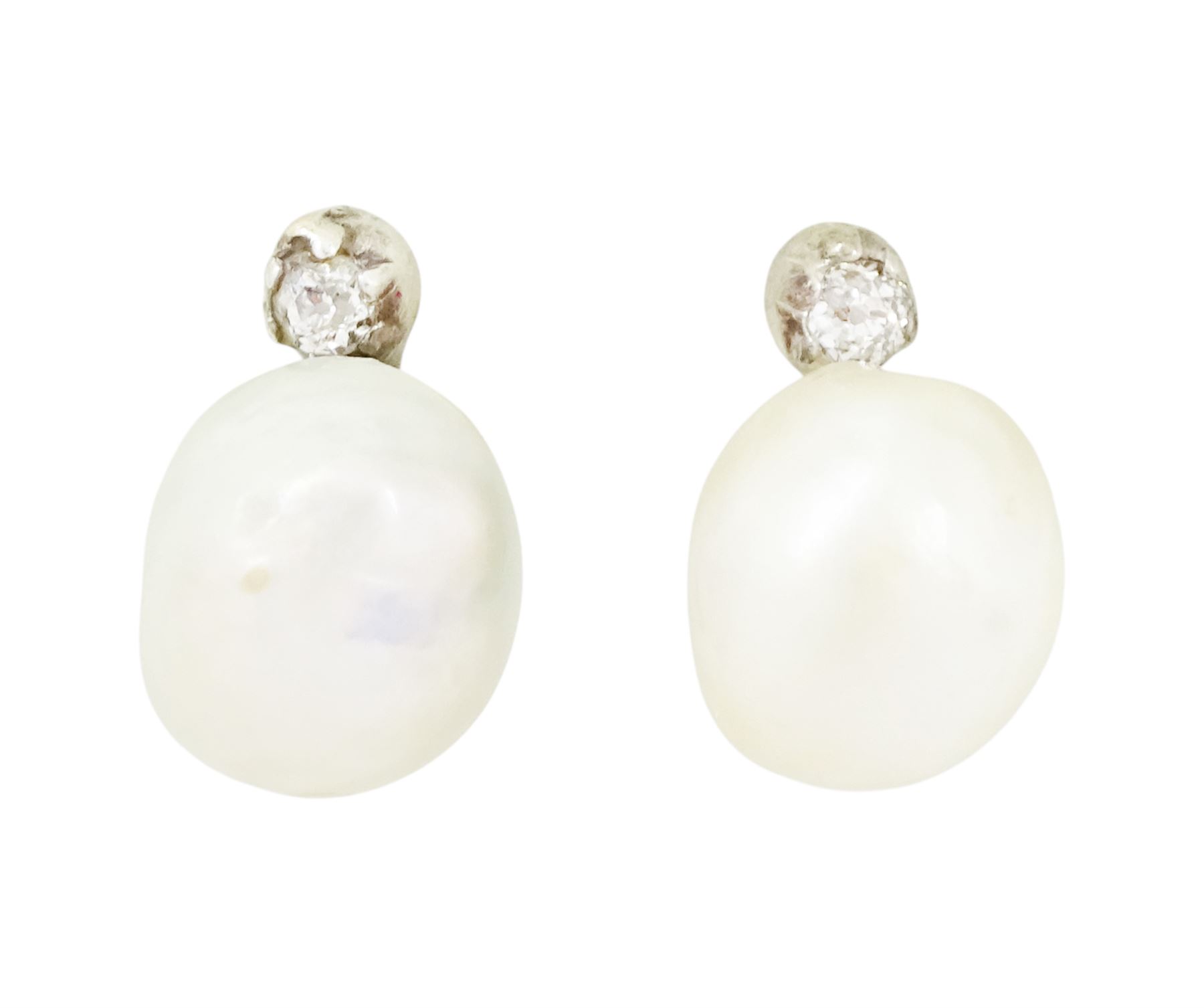Pair of 19th / early 20th century natural saltwater pearl and diamond earrings, one stud set with a single white / cream pearl, the other with a white / grey / cream pearl, each suspending from a single old cut diamond, total pearl weight approx 4.30 carat