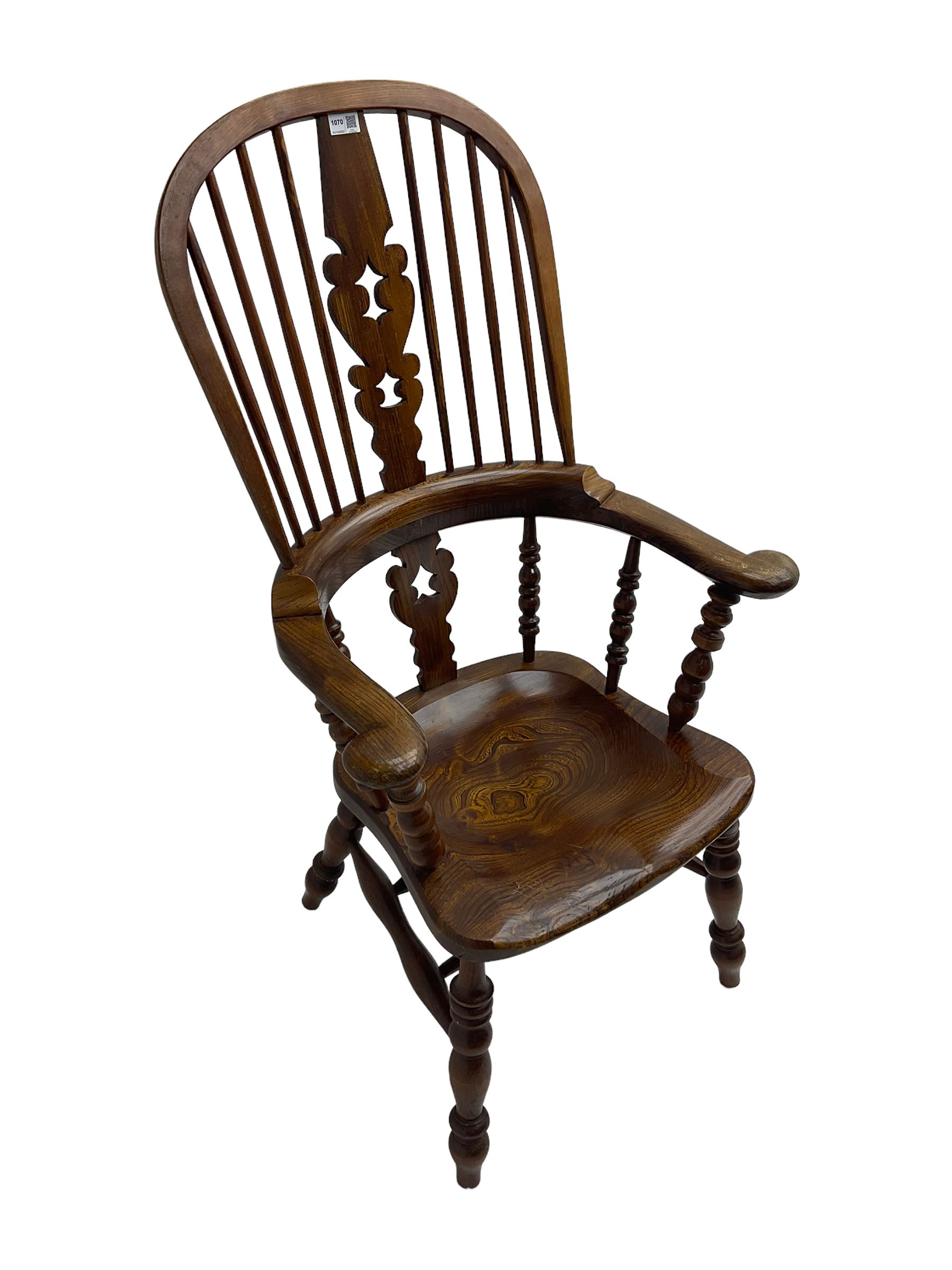 Traditional elm Yorkshire style Windsor armchair, high back with pierced and fret work splat, turned supports joined by double H stretcher