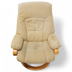 Himolla - A pair of swivel reclining chairs, beige upholstered with padded arms and high back rest, raised on a laminated circular wooden base with swivel mechanism 