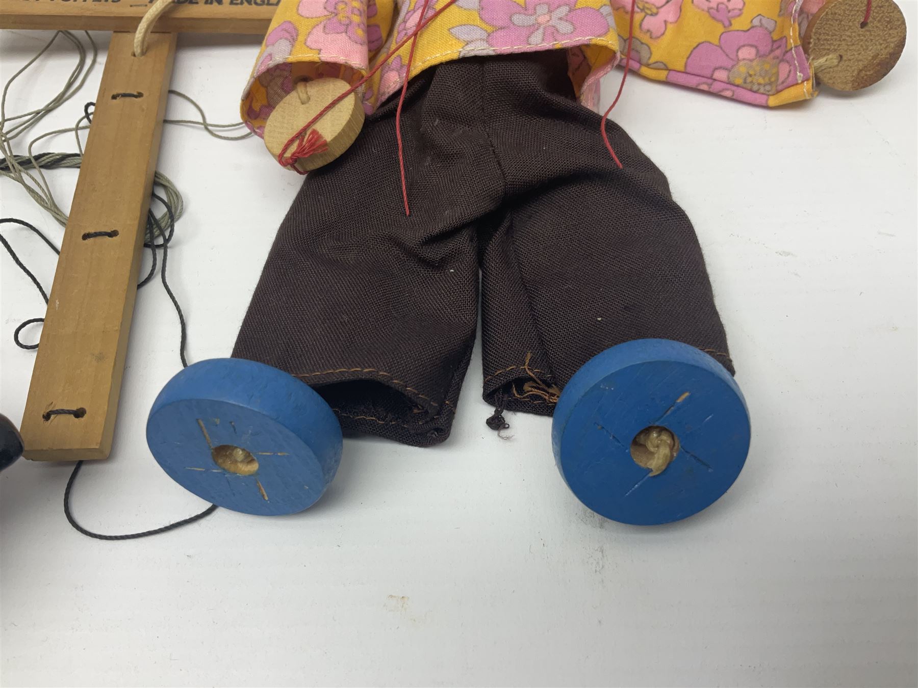Pelham Puppet - three puppets comprising a painted wooden duck with felt mouth and wings with metal joints H12cm, in original box and instructions; and two further examples Type A cat with a hollow body H12cm, and a boy H23cm (3) 