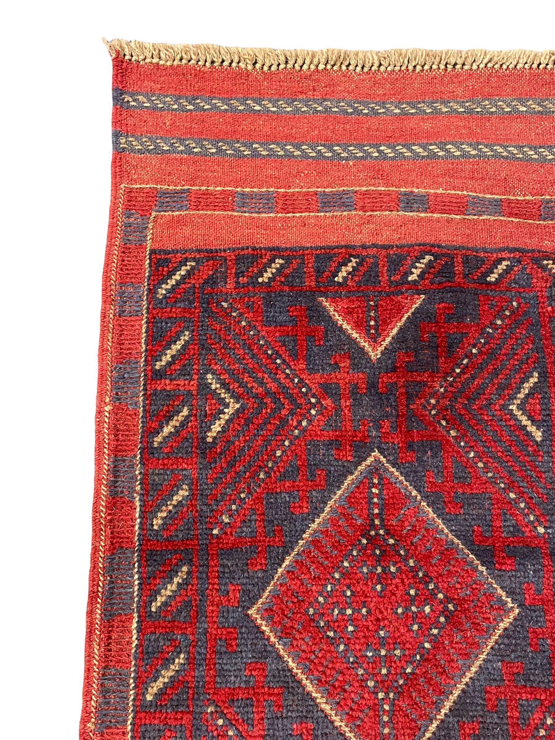 Meshwani red and blue ground runner, four lozenge medallions, overall geometric design 