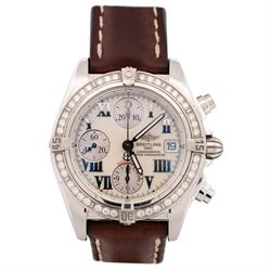 Breitling Chrono Cockpit gentleman's stainless steel diamond set automatic wristwatch, Ref. A13357, serial No. 2084732, cream dial with Roman numeral hour markers and date aperture, diamond set unidirectional rotating bezel, on Breitling brown leather strap, with fold-over clasp