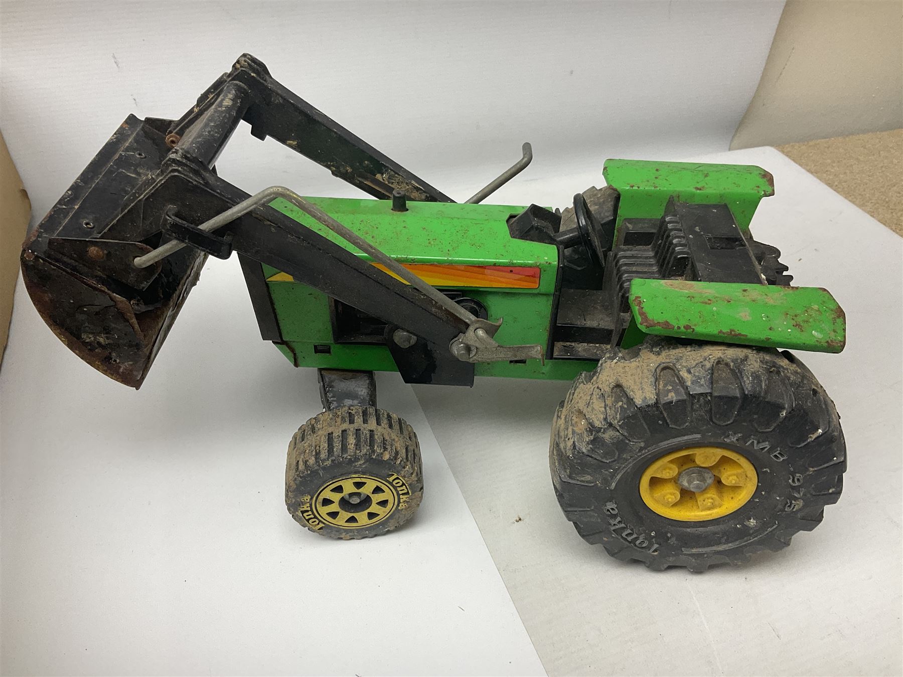 Tonka - fourteen pressed steel vehicles including Pick-up Truck, Tractor Digger, Mobile Crane, Trencher, Beach Buggy, two Bulldozers, Digger, Low Loader, Farm Trucks etc; and small quantity of spare parts (14)
