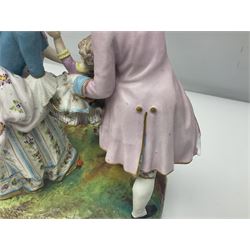 Jean Gille painted bisque family figure group, of a man and lady supporting their child, with applied mark beneath, H26cm