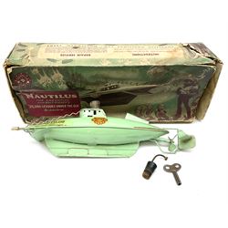 Sutcliffe Models ‘Nautilus’ tinplate and clockwork submarine from Walt Disney’s ’20,000 Leagues Under The Sea’ by Jules Verne, sea green body with various decals, rubber bung with periscope, boxed with inner cardboard display piece, produced between 1955-1960