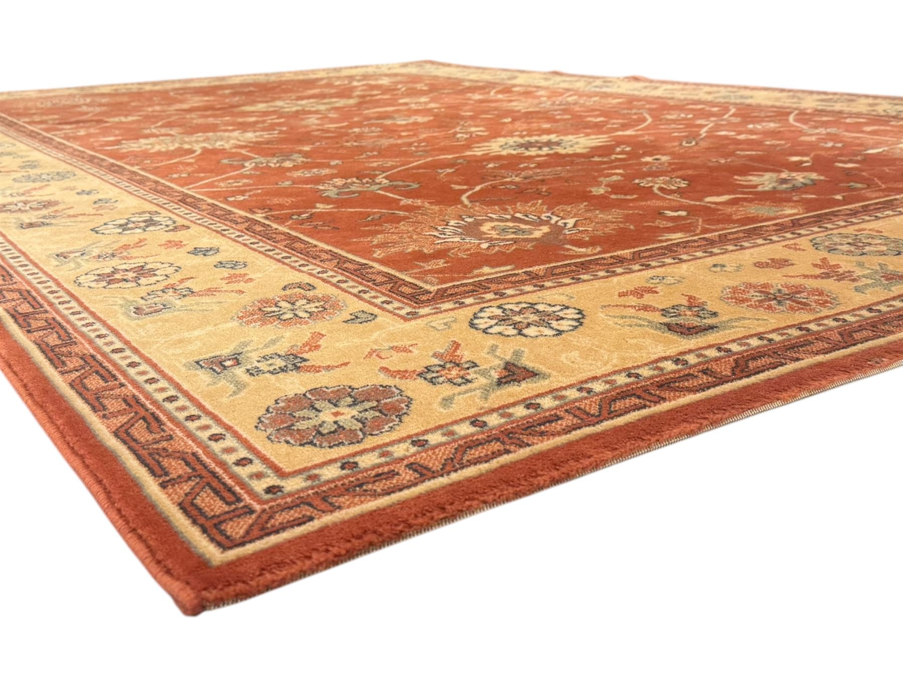 Late 20th century Royal Keshan 'Agra' hand-knotted wool rug, terracotta ground with central floral medallion and scrolling vines, enclosed by a cream border with repeating floral motifs