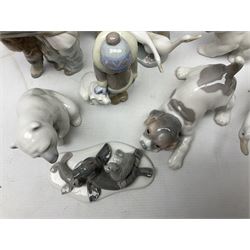 Seven Lladro figures, comprising Playful Puppy no 9135, Platero and Marcelino/Boy Hugging Donkey no 1181, Mini Seal Family no 5318, Attentive Polar Bear no 1207, Seated Polar Bear no1209, Eskimo Boy with Pet no 5238 and Girl with Geese no 1035, together with Nao goose