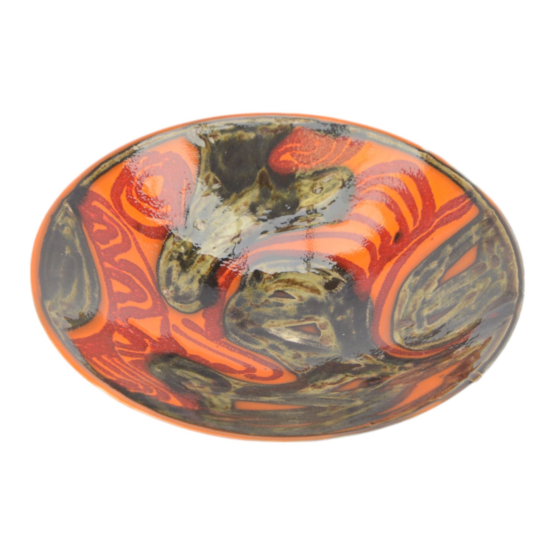 Three Poole pottery chargers, in Wild Poppy pattern, Delphis pattern and Aegean pattern, together with a Poole pottery dish and plate  