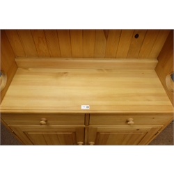  Solid pine dresser, projecting cornice, two glazed cupboards doors enclosing two shelf, above two drawers and two cupboard doors, plinth base, W101cm, H195cm, D35cm  