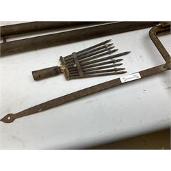 Blue and red painted gas powered bird / pest scarer, bearing label 'Exid bird & pest scarer, imported by C.R.E.A.C.O Hadleigh, Essex', , copper and brass Cymag gas hand pump, three eel spears and a set of badger tongs. Auctioneer's Note: These traps are sold as artefacts for ornamental purposes only as the use of some of them is illegal.