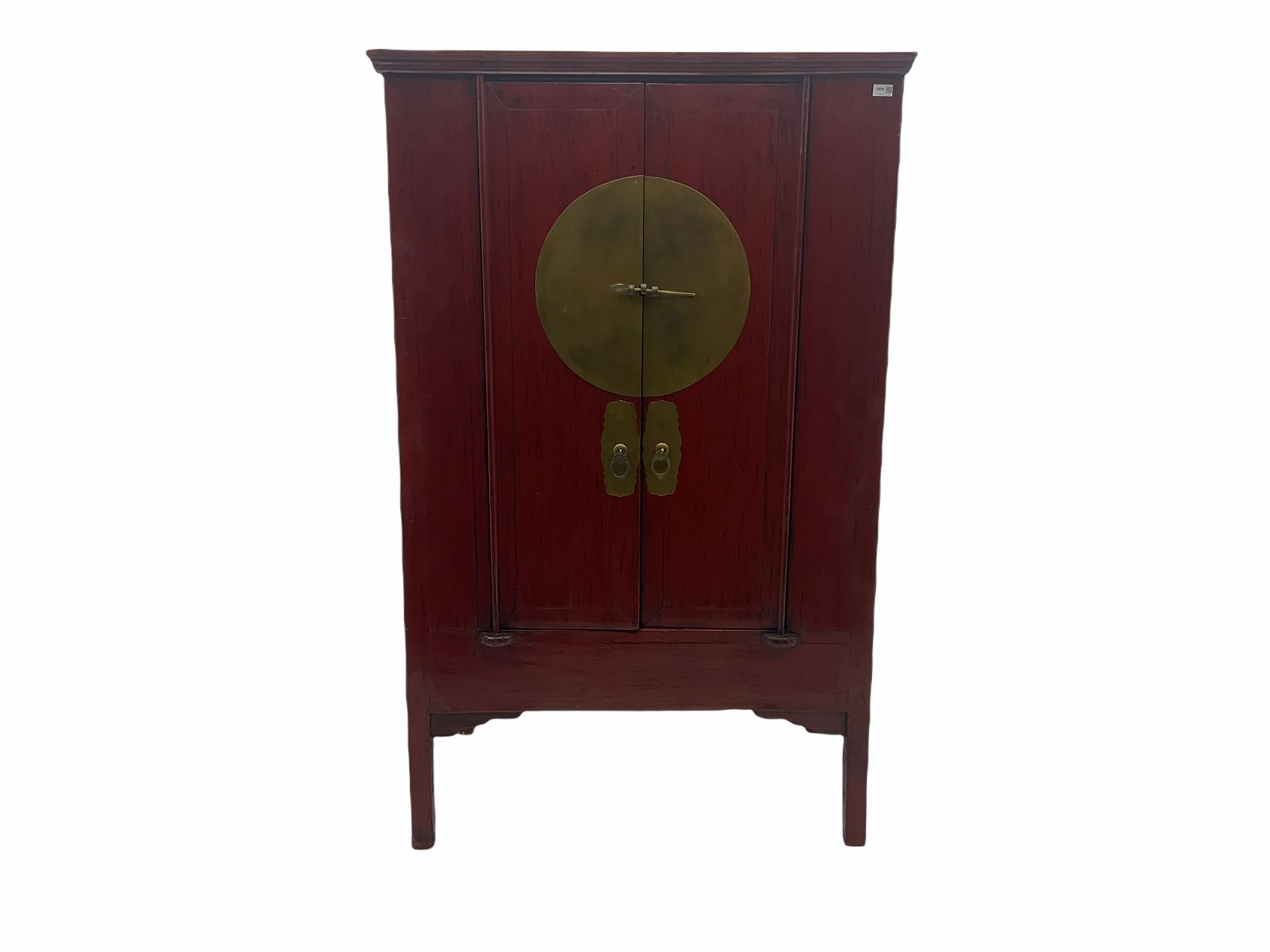  Chinese red lacquered elm and pine Moon marrige cabinet, enclosed by two doors, brass metalwork and hinges