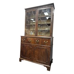 George III mahogany bookcase secretaire, dentil cornice over blind fret work frieze, enclosed by two astragal glazed doors, central secretaire drawer with fall front enclosing leather writing surface and small drawers, two flanking short drawers over double cupboard, on bracket feet