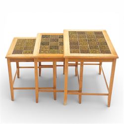 Mid 20th century Danish teak nest of three tables, rectangular tops inset with green geometric ceramic tiles within moulded frames, on square tapering supports united by stretchers