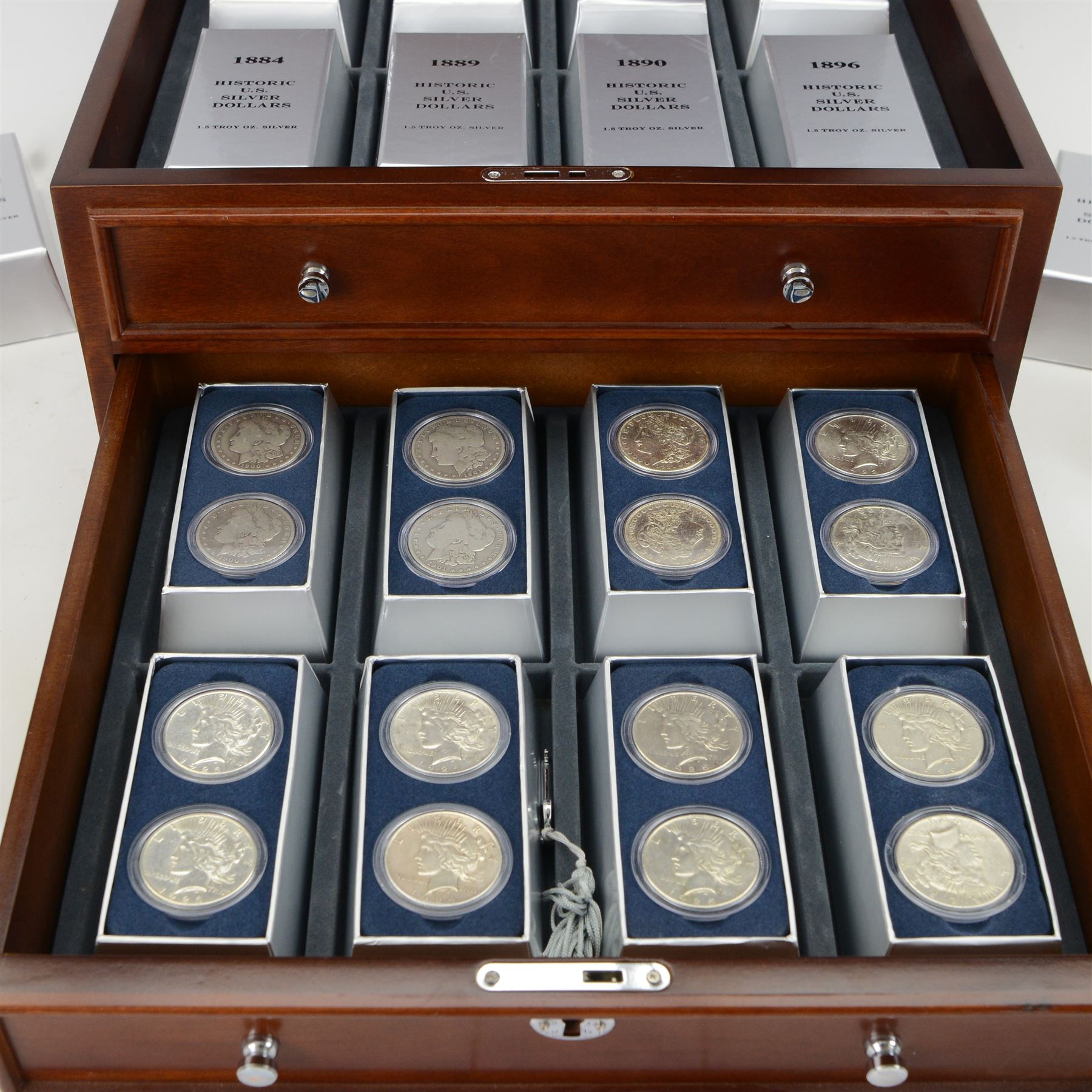 Thirty two United States of America silver dollar coins, 1879-1926, presented in Danbury Mint 'Historic US Silver Dollars' chest