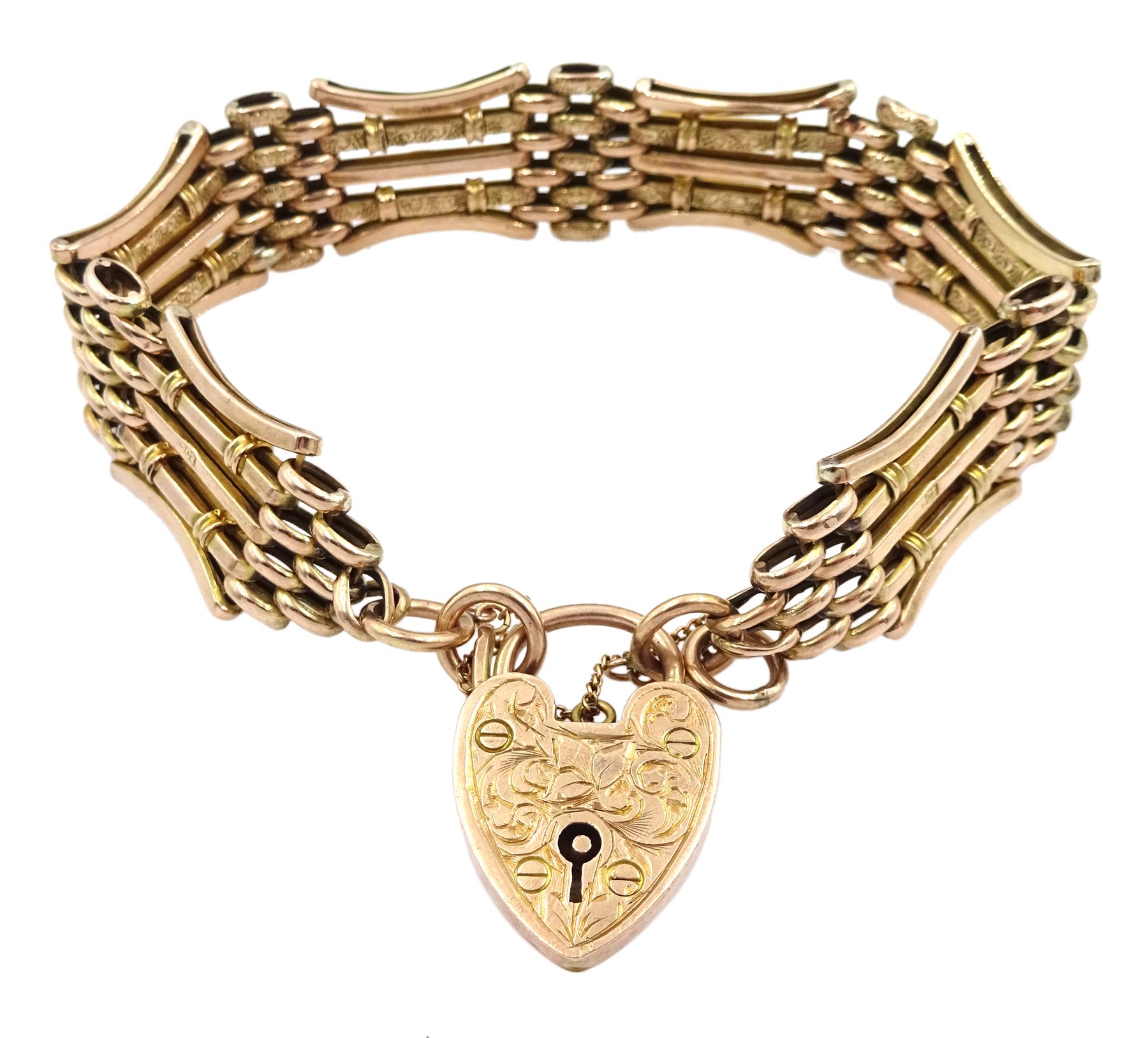 Early 20th century rose gold gate bracelet with engraved heart locket clasp, maker's mark W.J.S, stamped 9ct 