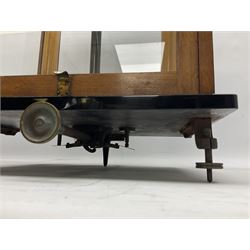 Set of laboratory balance scales by Reynolds & Branson of Leeds in fully glazed mahogany case with rise-and-fall front door, black vitrolite base with brass feet and hand cranked action L40cm H51.5cm D30cm; and bakelite cased set of brass weights