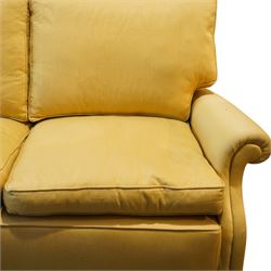 Pair of mid-20th century traditional two seat sofas, loose cushioned seat and back upholstered in pale gold fabric, on turned supports